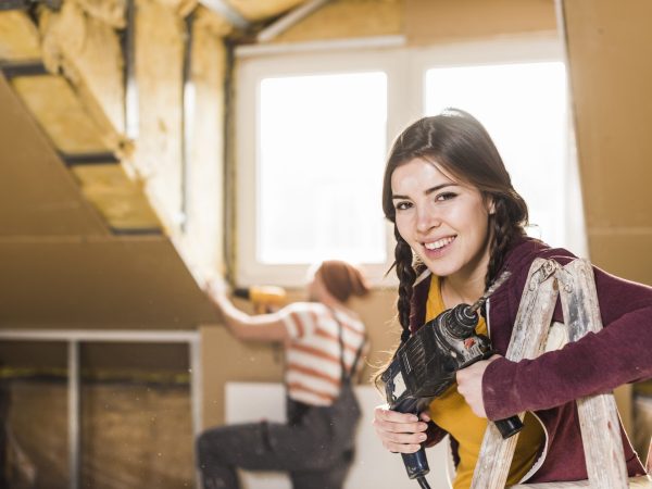 Independent young woman renovating her new home
